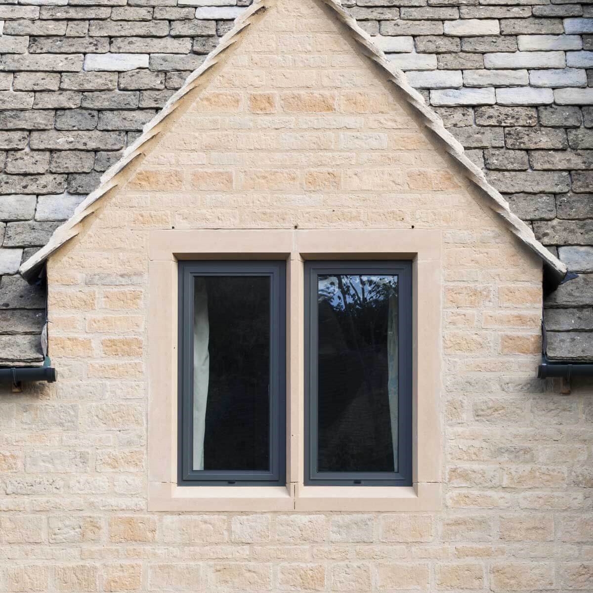 black window frame on a brick house